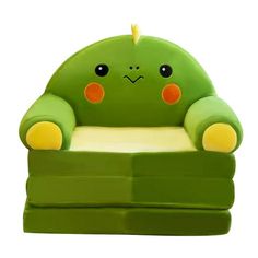 a green chair with an angry face on it's head and eyes, sitting in front of a white background