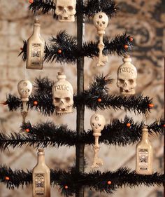 a christmas tree decorated with skulls and bottles