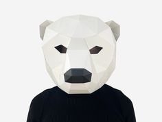 a person wearing a white bear mask on their head