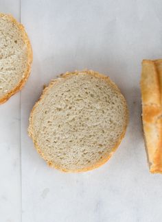 two loaves of bread sitting next to each other on top of a piece of paper