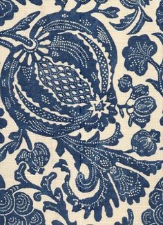 a blue and white fabric with an intricate design