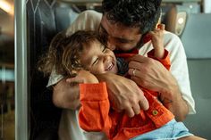 Dad making his little daughter laugh by kissing her neck. She is very happy, and laughing a lot. Laugh A Lot, Kiss, Free Stock Photos, Royalty Free Stock Photos