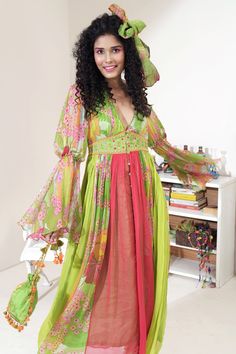 Green, pink panelled dress with floral printed motifs and embroidered waistband.
Component: 1
Pattern: Print and Embroidery
Type Of Work: Floral Print and Thread
Neckline: V neck
Sleeve Type: Bell Sleeves
Fabric: Georgette; Lining: Cotton
Color: Green,Pink
Other Details: 
Closure: Button front
Note: Head scarf and potli bag carried by the model is not for sale
Occasion: Resort - Aza Fashions Panelled Dress, Print And Embroidery, Potli Bag, Green Floral Print, Fashion App, Dress For Women, Floral Printed, Head Scarf, Aza Fashion