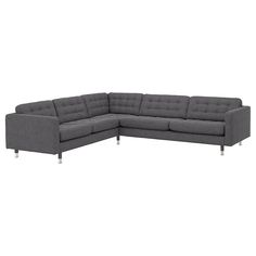 a gray sectional couch with chrome legs