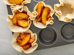 peaches are being prepared in muffin tins