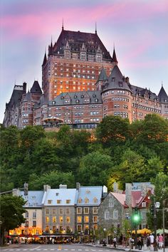 a large castle like building on top of a hill