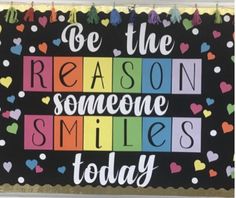 a sign that says be the reason someone smiles today