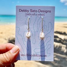 Add a touch of whimsy to any outfit with these Petite Cone Shell Earrings. Perfect for the ocean lover in your life, these earrings feature real cone shells and embody a playful, carefree spirit. A unique addition to any jewelry collection! The length from the top of the earwire are about 1⅜" Pairs with our matches our Petite Cone Shell Necklace Available in Sterling Silver and Gold Fill The shells and beach glass we use are collected in Hawai`i. All our shells are never collected "live". These Handmade Beachy Earrings As Gift, Handmade Beachy Earrings For Gift, Unique Drop Earrings For Beach, Unique Nickel-free Earrings For Beach, Handmade Ocean-inspired Pearl Earrings For Gift, Nickel-free Teardrop Earrings For Beach, Beach Teardrop Jewelry With Ear Wire, Teardrop Ear Wire Jewelry For Beach, Adjustable Shell Earrings With Ocean-inspired Style