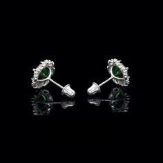 Absolutely gorgeous and unique halo design stud earrings featuring sparkling marquise white and round emerald green simulated diamonds. These dazzling stones are professionally set in halo design heavy post settings with secure screw-back fastenings that are also child secure. All crafted from 14K solid gold. Our created diamonds are synthetic simulants that feature brighter D color , FL / VVS1 clarity and ideal cut making them visually indistinguishable from natural diamonds that cost thousands Classic Green Diamond Earrings With Halo Design, Green Diamond Halo Design Earrings, Green Marquise Earrings Fine Jewelry, Elegant Green Emerald-cut Diamond Earrings, Green Emerald-cut Earrings With Diamond Accents, Diamond Solitaire Earrings, Solitaire Earrings, Full Eternity Ring, White Gold Band