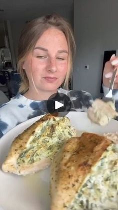 a woman is eating some food on a plate