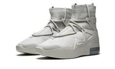 The Nike Air Fear of God 1 “Friends & Family” is a rare colorway given to those within the inner circle of Jerry Lorenzo's upscale streetwear brand.  Sporting a decidedly progressive appearance, the hybrid performance basketball and lifestyle shoe has been worn on-court by today’s NBA superstars and in city streets by style savants alike.  The upper features a premium Light Bone leather base that is contrasted by a staggered lacing system.  A tonal TPU support cage emits a technical component wh Upscale Streetwear, Family Shoes, Nike Air Fear Of God, Nba Superstars, The Inner Circle, Inner Circle, Fear Of God, City Streets, Friends And Family