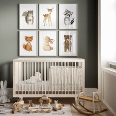 a baby's room with various animal prints on the wall