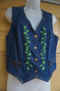 "Vintage embroidered denim vest. In good vintage condition!!. No size labeled but looks to be a small/medium. Please check measurements to ensure fit. measurements taken across front laid flat 19\" across front armpit to armpit 16.5\" across front of waist 20\" length top of shoulder to bottom" Casual Fitted Vest With Floral Embroidery, Fitted Embroidered Denim Vest Casual, Vintage Fitted Embroidered Vest, Vintage Embroidered Fitted Vest, Casual Embroidered Fitted Denim Vest, Fitted Vintage Vest With Embroidery, Fitted Cotton Vest With Embroidery, Fitted Embroidered Cotton Vest, Fitted Cotton Embroidered Vest