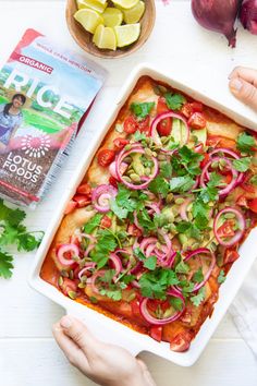 A colorful vegan rice casserole topped with avocado, cherry tomatoes, red onion, cilantro, and seeds. A packet of lotus foods' organic red rice is beside it. Long Grain Rice, Red Rice, Family Farm, 30 Minutes, Lotus, Grain, Gluten Free, Thailand, Rice