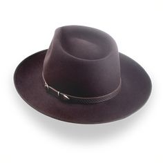 Description Materials Craftsmanship Hat Care Shipping Returns Product Description A Stylish and Functional Men's Western Fedora Elevate your rustic style with the Ulysses, a men's western fedora handcrafted from luxurious rabbit fur felt. Featuring a smooth finish and a distinctive teardrop crown, this hat combines classic western flair with modern sophistication. With a 4 3/4" crown height and a 2 7/8" ribbon-bound snap brim, the Ulysses strikes the perfect balance between style and functionali 1940 Style, Hats For Big Heads, Outdoor Hut, The Raid, Mens Western, Homburg, Leather Hat, Crown Design, Leather Hats