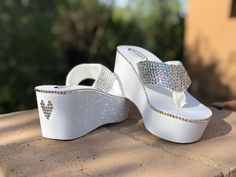 "These beautiful comfortable Swarovski Crystal flip flops will keep you dancing on your feet all night long. They are as comfy as they are beautiful. The wedge heel measures 3\" with a platform of 1 1/2\" in the front. They have over 850 Swarovski crystals embellished on the strap and shoe. They can be custom ordered in any color including Crystal clear. Make your day more incredible and order these. You will be able to wear them after the wedding with your jeans, dresses and everything else all High Heel Thong Sandals, Bling Flip Flops, Backyard Hammock, Wedding Flip Flops, Diy Sandals, Barbie Shoes, Platform Flip Flops, Bedroom Slippers, Crystal Heels