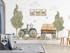 a room with a tractor and trees painted on the wall in front of it,