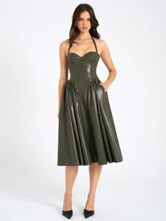 Introducing the Eliana dress, a stunning olive green midi full dress crafted from luxurious vegan leather. This dress features an adjustable halter neckline and padded cups for a perfect fit and added comfort. The built-in corset provides structured support, while the drop waist design enhances your silhouette. Finished with an invisible zipper for a seamless look, this dress effortlessly combines modern style with timeless elegance, making it a standout piece in any wardrobe. Elaina Olive Vegan Leather Midi Dress, Full Dress, Dress Crafts, Halter Neckline, Leather Dress, Drop Waist, Corset Dress, Dress Romper, Invisible Zipper