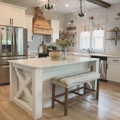 a kitchen island with two stools in front of it and the words explore above it