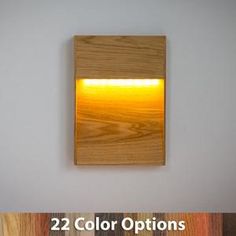 a wooden square with yellow light in the center and below it is an image of some wood