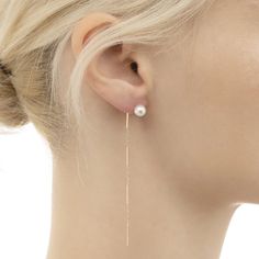 A tiny gold bar trimmed with two Akoya pearl is suspended from delicate ear threads. Horizontal metal bars of the thread reflects the light beautifully. It can be worn long or threaded through multiple ear piercings. - Cultured Akoya Pearl. - 10k yellow gold. - Drop 8.5cm - Pearl diameter 5.5-6mm (approximately) - Each Minimalist Pearl Chain Linear Earrings, Delicate Gold Pearl Threader Earrings, Dainty Long Drop Linear Earrings With Pearl Charm, Minimalist Pearl Chain Drop Threader Earrings, Minimalist Pearl Chain Threader Drop Earrings, Minimalist Pearl Chain Threader Dangle Earrings, Dainty Gold Linear Earrings With Pearl Charm, Minimalist White Linear Earrings With Pearl Chain, Delicate Gold Threader Earrings With Pearl Charm