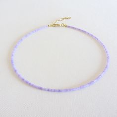 Purple seed bead choker necklace, Lilac beaded choker, Dainty bead necklace, 14k gold filled jewelry There are two clasp options, one is a stainless steel clasp and chain, the second option the clasp and chain are made of brass with 14k gold plating so the necklace will not lose its look over time! Measure the length of your neck with a measuring tape or you can use any thread, rope, or cable for telephone and after apply the measurements to a regular ruler. Choker is 12 inches with a 2 inches a Seed Bead Choker, Bead Choker Necklace, Preppy Jewelry, Second Option, Bead Choker, Beaded Choker Necklace, Measuring Tape, Czech Beads, Seed Bead Jewelry