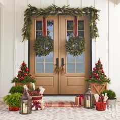 the front door to a home decorated for christmas