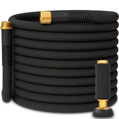 a black hose with gold fittings on the end and an extension cord attached to it