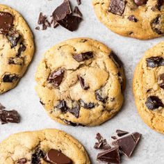 several chocolate chip cookies on a baking sheet