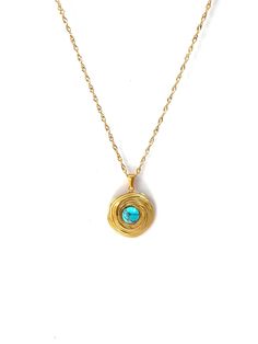 Adorn yourself with the serenity of the sea through the Aqua Necklace. This necklace echoes the design of the Aqua ring, featuring a natural turquoise circular stone with a golden detail, suspended gracefully as a pendant. Named "Aqua," this piece brings the calming beauty of turquoise to your neckline, harmonizing natural elements with luxurious style. 18k Gold Plated Nickel Free & Hypoallergenic Natural Stone Turquoise Circle Jewelry For Gift, Gold Turquoise Pendant Necklace With Gemstone, Gold Turquoise Necklace With Round Pendant, Turquoise Wire Wrapped Round Necklace, Aqua Ring, Aqua Necklace, Natural Turquoise Stone, Adventure Style, Resort Collection