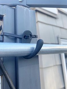 a close up of a metal bar on a building