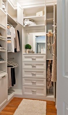 a white closet filled with lots of drawers