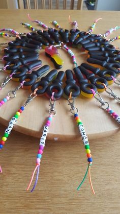 a wooden table topped with lots of black beads