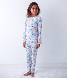 "Get ready for some magical dreams with our Retro Rainbows Pajama. Made from soft bamboo, this playful pajama features a print of rainbows and butterflies, aptly named 'Retro Rainbows'. Say goodbye to scratchy, uncomfortable pajamas and hello to cozy, whimsical nights!" 93% Bamboo; 7% Spandex Wash cold with like colors; stays soft wash after wash Fits snug; not treated with flame retardants Unicorn Print Cotton Sleepwear For Loungewear, Cute Unicorn Print Sleepwear For Loungewear, Playful Unicorn Print Sleepwear For Sleepover, Playful Unicorn Print Sleepwear, Pink Unicorn Print Sleepwear For Bedtime, Pink Unicorn Print Sleepwear, Rainbows And Butterflies, Toddler Pajamas, Blue Butterflies