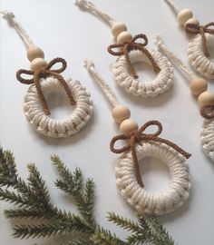 four pieces of rope with wooden beads hanging from them