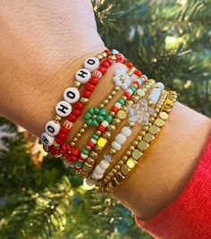 Christmas Bracelet Stack Mix and match your favorite Christmas bracelets CARING TIPS FOR YOUR JEWELRY ⭐️Treat and store with care. ⭐️ For longevity, avoid exposing your jewelry to water. ⭐️ Avoid having direct contact with lotions, perfumes, sanitizers as these chemicals may cause discoloration of your jewelry. Christmas Jewelry Diy, Holiday Bracelets, Bracelet Christmas, Christmas Bracelet, Bracelet Diy, Bracelet Ideas, Bead Bracelets, Ho Ho Ho, Flower Bracelet