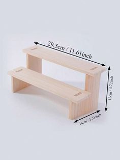 two wooden benches sitting next to each other on top of a white surface with measurements