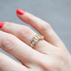 Yellow-hued diamond baguettes scatter across this V-shaped ring by Ellis Mhairi Cameron. Each stone is hand set in softly distressed gold, shining like buried treasure. Ellis draws inspiration from the medieval jewelry hoards found in Scotland. Her rings are unique, beautiful, and mysterious. Stones: Total .85tcw Yellow Baguette DiamondsMetal: 14k Yellow GoldMeasurements: Setting length: 18.9mm, Setting width: 8.5mm, Setting height: 2.9-2.1mm, Band width: 1.6-2.4mm Size 6, 6.5 in stock Shipping Wolf Jewelry, Buried Treasure, Medieval Jewelry, Baguette Diamond, Pearl Studs, Pearl Drop Earrings, Pearl Drop, V Shape, Pearl White