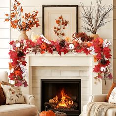 a fireplace decorated with fall leaves and candles