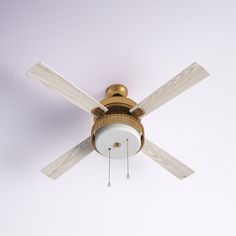 a ceiling fan with two white blades and a light fixture on the top of it