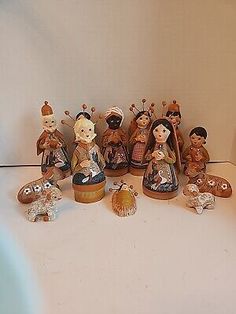 a group of figurines sitting next to each other on a white counter top