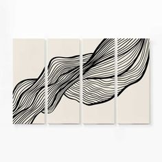 three black and white paintings on a wall