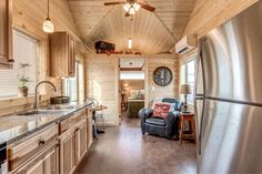 a kitchen and living room in a small cabin