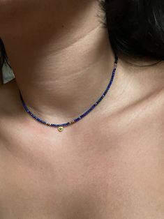 Tiny Lapis lazuli necklace, dainty gold gemstone necklace, silver choker for women, minimalist necklace, healing crystal necklace Dainty choker with tiny Lapis Lazuli beads and a small sterling silver heart charm with cz. These simple, delicate and versatil choker that you can wear at any occassion. Confortable to use and wear, is the perfect outfit for your day. You can combinate with other dainty chokers or necklaces at the same time. Layering necklace. (The gold chain of the picture is not in Gold Gemstone Necklace, Tiny Heart Necklace, Black Beads Mangalsutra, Sterling Silver Choker, Dainty Choker, Lapis Lazuli Necklace, Silver Choker, Crystal Choker, Tiny Heart