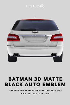 the back end of a white car with batman's logo on it and text that reads