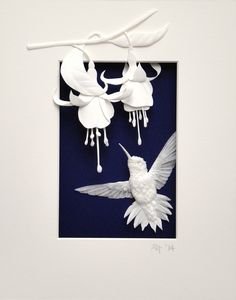 a white bird flying in the air next to a flower on a blue and white wall