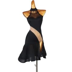 a mannequin with sheer black and gold dress on display