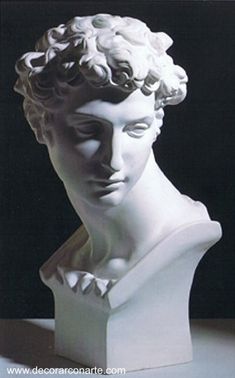 a white marble busturine with curly hair