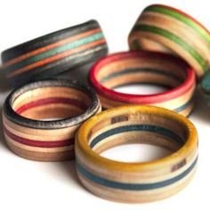 five different colored wooden rings sitting on top of each other