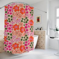 a pink and orange shower curtain in a bathroom